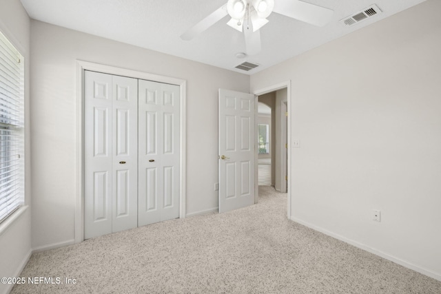 3384 Olympic Dr, Green Cove Springs, FL 32043 - unfurnished bedroom featuring carpet flooring, multiple windows, and a closet