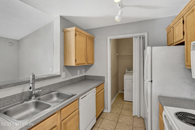 7701 Timberlin Park Blvd Unit 1535, Jacksonville, FL 32256 - kitchen with white appliances, a sink, rail lighting, washer / clothes dryer, and light tile patterned flooring