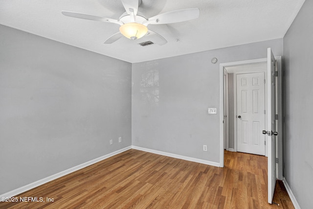 7701 Timberlin Park Blvd Unit 1535, Jacksonville, FL 32256 - unfurnished room with ceiling fan, wood finished floors, and baseboards