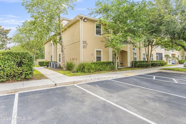 2615 Golden Lake Loop, Saint Augustine, FL 32084 - view of building exterior with uncovered parking and cooling unit