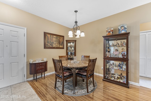 2615 Golden Lake Loop, Saint Augustine, FL 32084 - dining area with a chandelier, light wood-type flooring, and baseboards