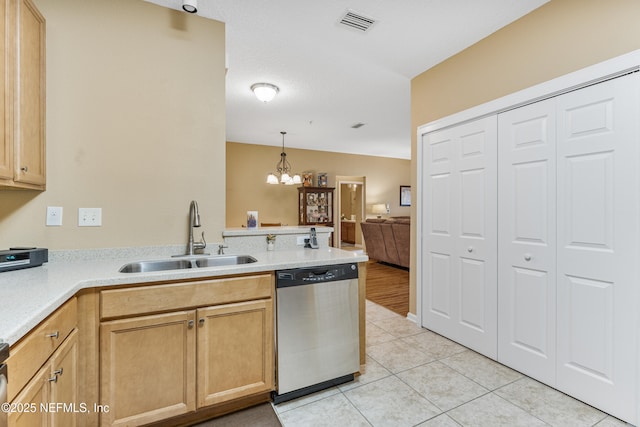 2615 Golden Lake Loop, Saint Augustine, FL 32084 - kitchen featuring stainless steel dishwasher, a sink, a peninsula, a chandelier, and light countertops