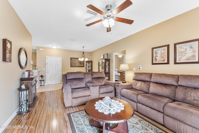 2615 Golden Lake Loop, Saint Augustine, FL 32084 - living room featuring light wood-style flooring, ceiling fan, baseboards, and a chandelier