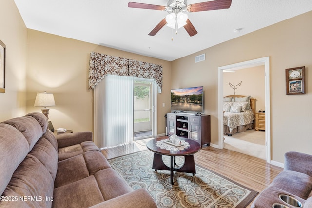 2615 Golden Lake Loop, Saint Augustine, FL 32084 - living area with wood finished floors, ceiling fan, and baseboards