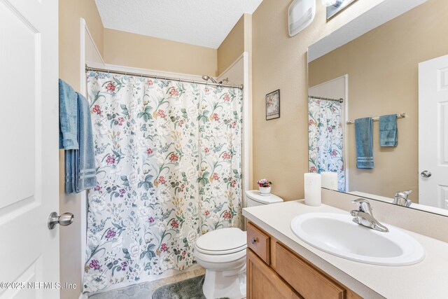 2615 Golden Lake Loop, Saint Augustine, FL 32084 - full bath with vanity, toilet, a shower with curtain, and tile patterned flooring