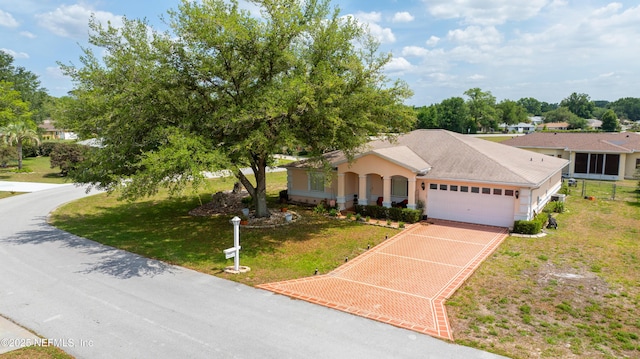 10031 SW 62nd Cir, Ocala, FL 34476 - single story home with an attached garage, a front lawn, and driveway