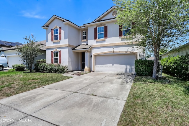 1071 Wetland Ridge Cir, Middleburg, FL 32068 - traditional-style home with stucco siding, concrete driveway, a garage, and a front lawn