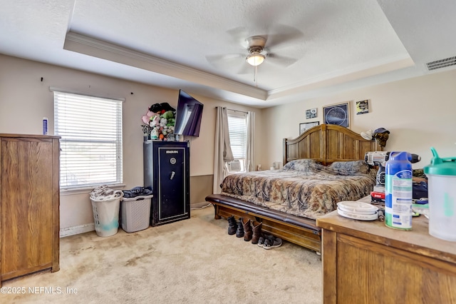 1071 Wetland Ridge Cir, Middleburg, FL 32068 - bedroom with a raised ceiling, multiple windows, light carpet, ornamental molding, and baseboards