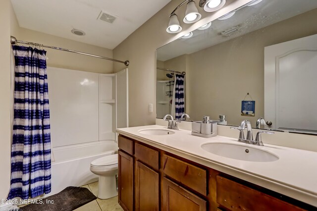 1071 Wetland Ridge Cir, Middleburg, FL 32068 - bathroom with shower / bath combo with shower curtain, double vanity, tile patterned floors, and toilet
