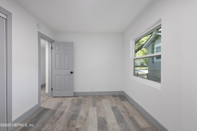 2210 Lamee Ave, Jacksonville, FL 32207 - spare room with light wood finished floors, baseboards, and a smoke detector