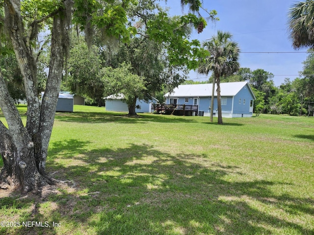 109 Laurel Ln, Crescent City, FL 32112 - view of green lawn featuring a deck