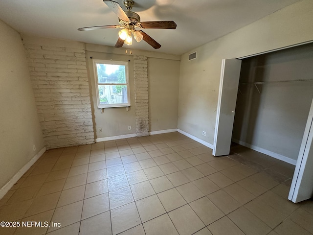 1927 Fouraker Rd, Jacksonville, FL 32210 - unfurnished bedroom featuring light tile patterned floors, a closet, and a ceiling fan