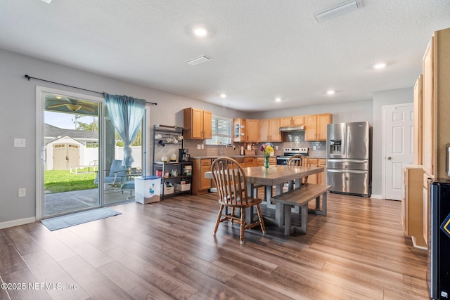 2522 Lantana Ln, Green Cove Springs, FL 32043 - dining space with wood finished floors, recessed lighting, baseboards, and a textured ceiling