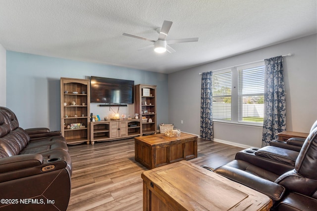 2522 Lantana Ln, Green Cove Springs, FL 32043 - living area featuring wood finished floors, ceiling fan, a textured ceiling, and baseboards