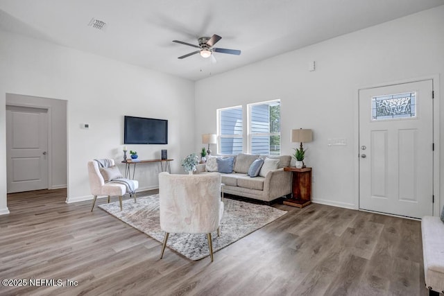 4410 Vicki St, Hastings, FL 32145 - living room featuring a ceiling fan, light wood-style flooring, and baseboards