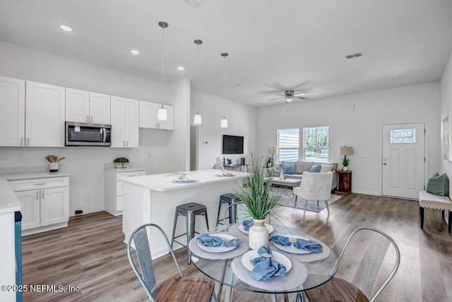 4410 Vicki St, Hastings, FL 32145 - dining room featuring light wood-style flooring, ceiling fan, recessed lighting, and baseboards