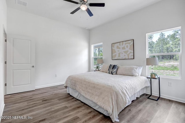 4410 Vicki St, Hastings, FL 32145 - bedroom featuring wood finished floors, baseboards, and a ceiling fan
