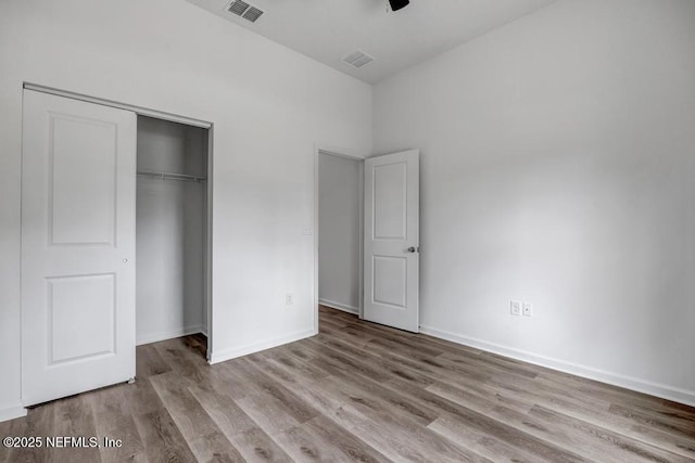 4410 Vicki St, Hastings, FL 32145 - unfurnished bedroom with wood finished floors, a closet, and baseboards