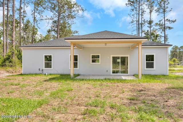4410 Vicki St, Hastings, FL 32145 - rear view of property with a patio, a shingled roof, and stucco siding