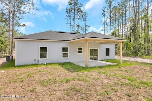 4410 Vicki St, Hastings, FL 32145 - back of house with a patio, stucco siding, central AC unit, and a shingled roof