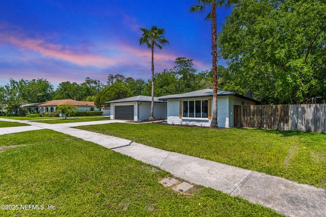 4923 Lofty Pines Cir E, Jacksonville, FL 32210 - single story home with concrete driveway, a garage, and stucco siding