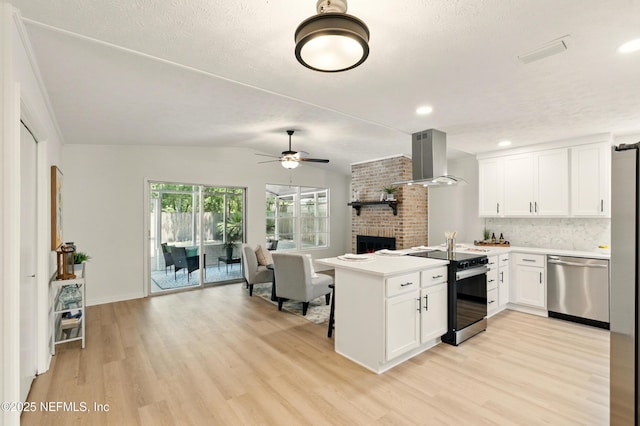 4923 Lofty Pines Cir E, Jacksonville, FL 32210 - kitchen featuring range with electric cooktop, stainless steel dishwasher, wall chimney exhaust hood, open floor plan, and a peninsula