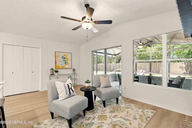 4923 Lofty Pines Cir E, Jacksonville, FL 32210 - sitting room featuring a ceiling fan, lofted ceiling, light wood finished floors, and baseboards