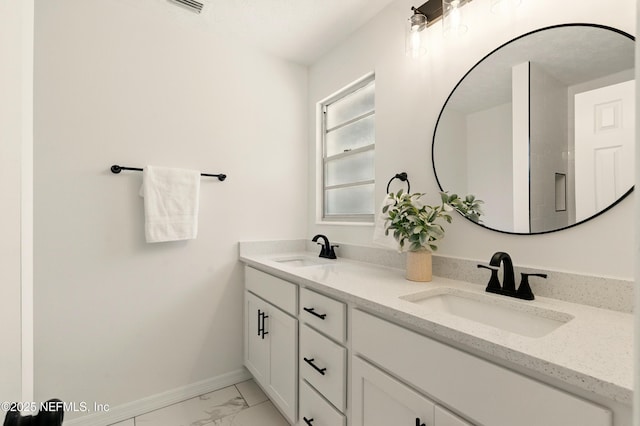 4923 Lofty Pines Cir E, Jacksonville, FL 32210 - bathroom with baseboards, marble look tiles, and double vanity