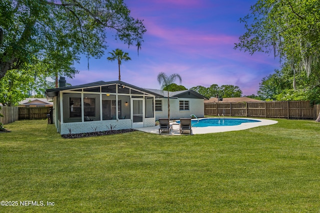 4923 Lofty Pines Cir E, Jacksonville, FL 32210 - rear view of property featuring a sunroom and a patio