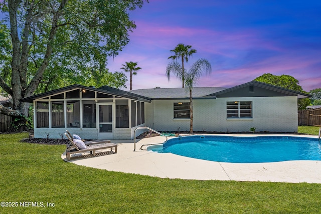 4923 Lofty Pines Cir E, Jacksonville, FL 32210 - view of pool featuring a sunroom and a patio area