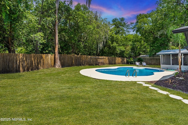 4923 Lofty Pines Cir E, Jacksonville, FL 32210 - pool at dusk with a sunroom