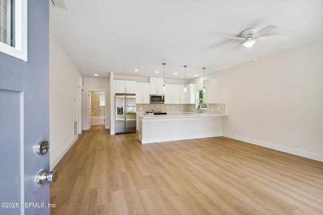 unfurnished living room with light wood-type flooring, baseboards, a ceiling fan, and recessed lighting