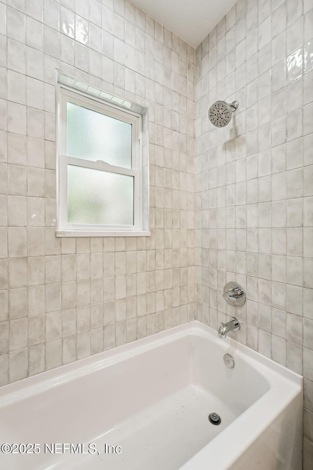 bathroom featuring shower / bath combination