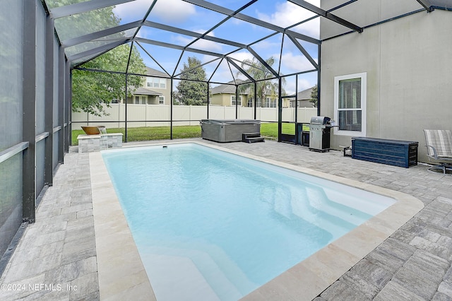 3051 Paddle Creek Dr, Green Cove Springs, FL 32043 - view of swimming pool with a hot tub, area for grilling, a patio, a fenced backyard, and a lanai