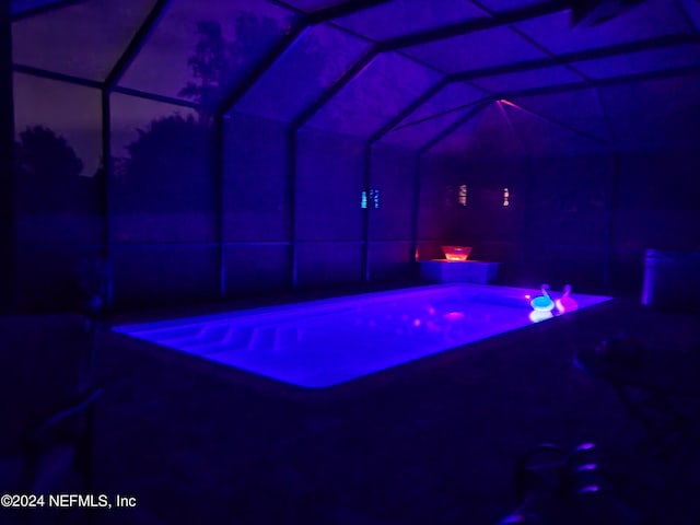 3051 Paddle Creek Dr, Green Cove Springs, FL 32043 - pool at twilight with a lanai, a patio area, an outdoor pool, and a jacuzzi