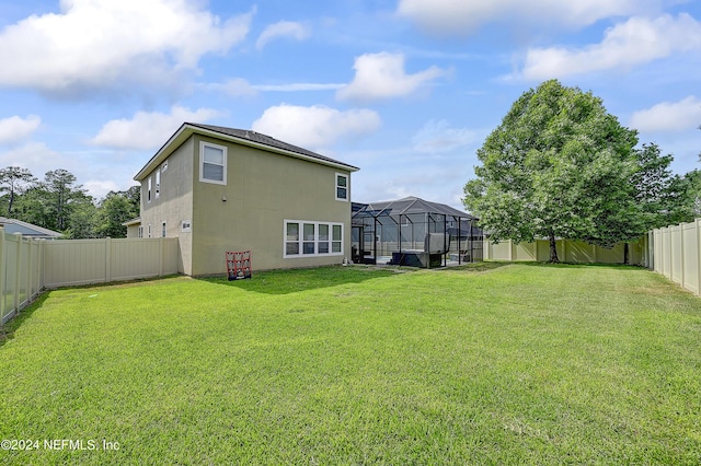 3051 Paddle Creek Dr, Green Cove Springs, FL 32043 - rear view of house with a lanai and stucco siding