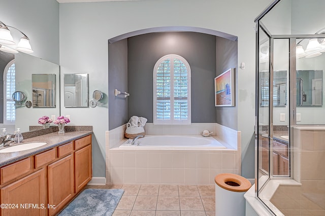 3051 Paddle Creek Dr, Green Cove Springs, FL 32043 - full bath with tile patterned floors, a bath, a stall shower, and vanity