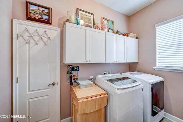 3051 Paddle Creek Dr, Green Cove Springs, FL 32043 - laundry room with independent washer and dryer, cabinet space, and baseboards
