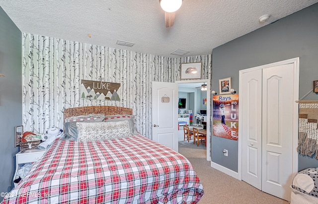 3051 Paddle Creek Dr, Green Cove Springs, FL 32043 - carpeted bedroom with a textured ceiling, a closet, baseboards, and ceiling fan