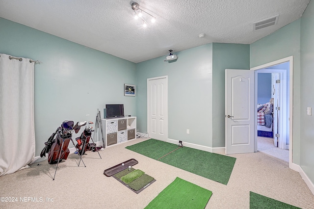 3051 Paddle Creek Dr, Green Cove Springs, FL 32043 - recreation room with carpet floors, baseboards, and a textured ceiling