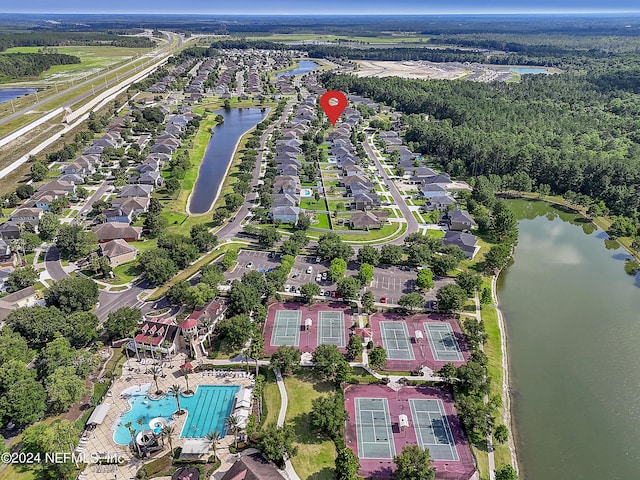 3051 Paddle Creek Dr, Green Cove Springs, FL 32043 - aerial perspective of suburban area featuring a large body of water, a pool area, and a forest