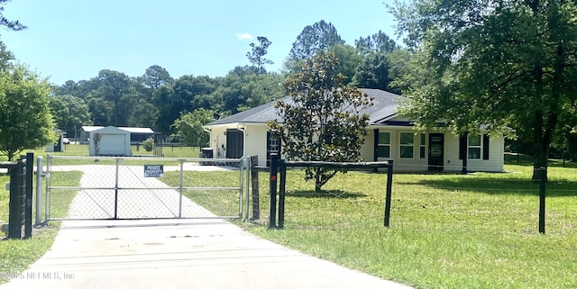 2253 S Mimosa Ave, Middleburg, FL 32068 - view of front facade featuring driveway and a gate