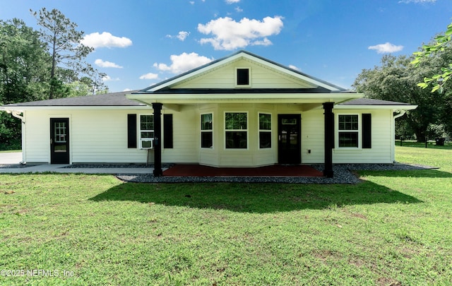 2253 S Mimosa Ave, Middleburg, FL 32068 - back of property with a yard and a patio area