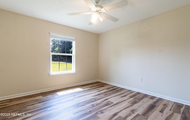 2253 S Mimosa Ave, Middleburg, FL 32068 - unfurnished room featuring wood finished floors, baseboards, and a ceiling fan