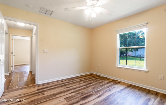2253 S Mimosa Ave, Middleburg, FL 32068 - spare room featuring wood finished floors and baseboards