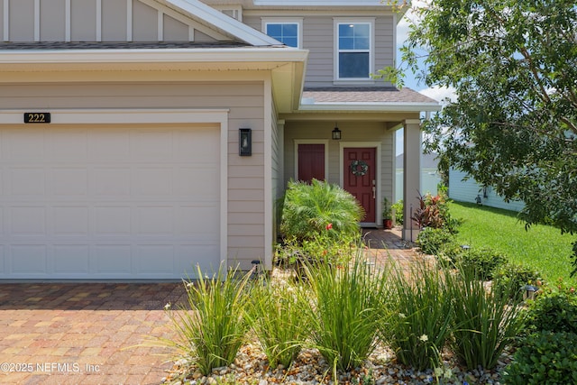 222 River Mist Dr, Saint Augustine, FL 32095 - view of front of home featuring roof with shingles, board and batten siding, and driveway