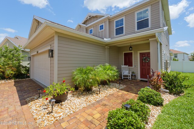 222 River Mist Dr, Saint Augustine, FL 32095 - view of front of property with board and batten siding and an attached garage