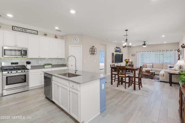 222 River Mist Dr, Saint Augustine, FL 32095 - kitchen with appliances with stainless steel finishes, a sink, light wood-style floors, backsplash, and recessed lighting