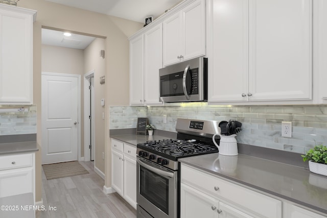 222 River Mist Dr, Saint Augustine, FL 32095 - kitchen featuring appliances with stainless steel finishes, white cabinetry, backsplash, and recessed lighting