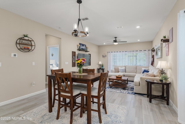 222 River Mist Dr, Saint Augustine, FL 32095 - dining room featuring light wood-style flooring, ceiling fan, baseboards, recessed lighting, and a chandelier